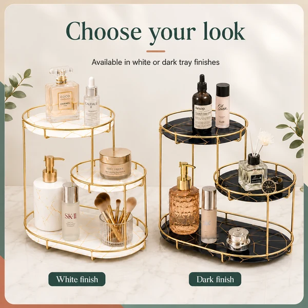 Two round three-tier cosmetic trays shown side by side with cosmetics on top, labeled 'Choose your look' and 'Available in white or dark tray finishes.' The left tray has a white marble look with gold metal framing, and the right tray has a black marble look with gold metal framing.